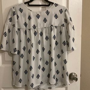 Loft blouse size small. Cream background with blue and red print.